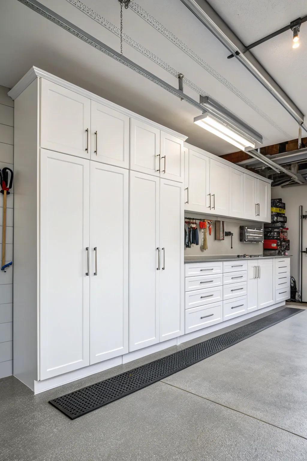 Brighten your garage with white cabinets for a fresh, open feel. #BrightSpaces #GarageIdeas