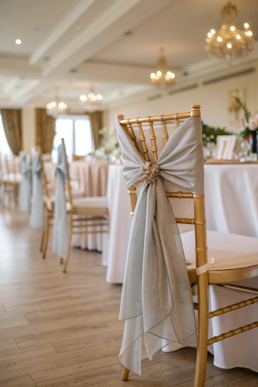 Stylish chair decorations add a cohesive touch to your ballroom theme.