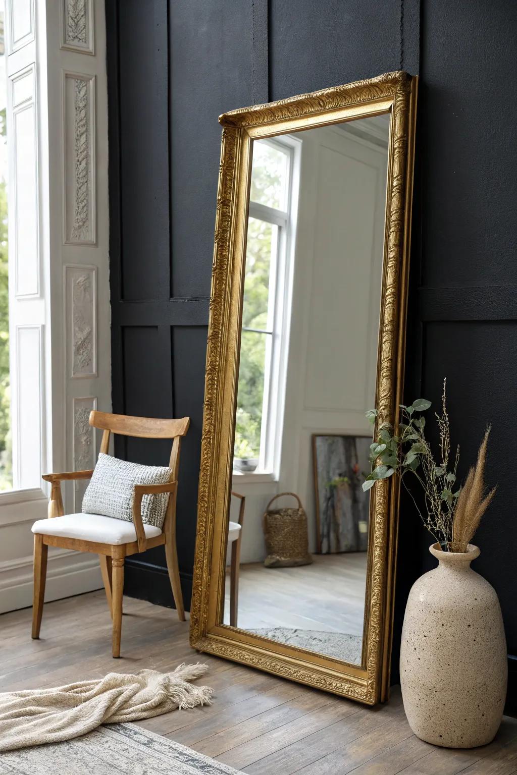 Reflect elegance and light with a stunning gold mirror against a dramatic black wall.